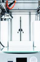 3d printer with bright red filament. photo