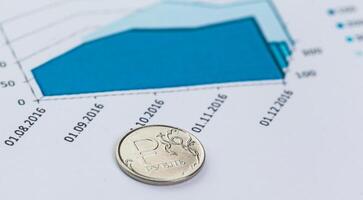 Graph Of Stock Market With Stacks Of Coins photo