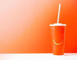 cardboard cup with a straw photo