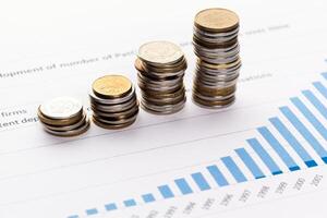 Graph Of Stock Market With Stacks Of Coins photo
