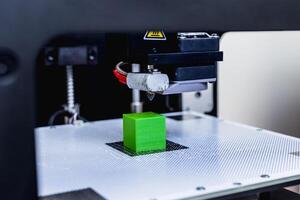 head of 3d printer in action photo