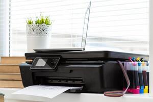 Printer and computer. Office table photo