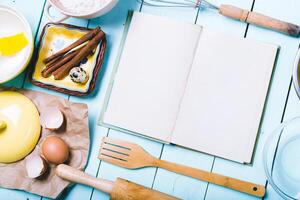 Preparation of the dough. Ingredients for the dough - Eggs and flour with a rolling pin. On wooden background. photo