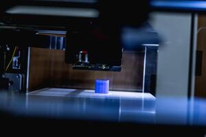 head of 3d printer in action photo