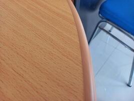 table side surface with brown wood textured wallpaper photo