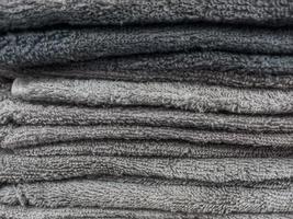 A stack of clean, soft towels in monochrome colors photo