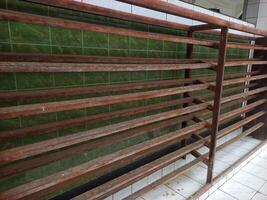 Shoe rack made of wood with several levels photo