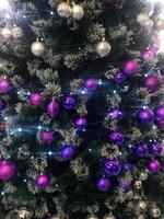 Christmas tree with shiny hanging decorations photo