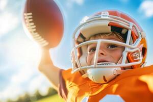 Young football rugby player celebrating with excitement on the field during a sunny day, showcasing determination and joy photo