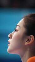Profile of a focused athlete during a competition with a blurred background in an indoor arena at a sports event photo