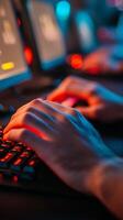 Hands typing on a mechanical keyboard in a dimly lit gaming setup at night with colorful LED lights glowing in the background photo