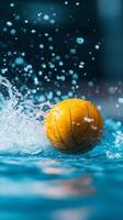 A bright yellow water polo ball splashes through clear water, capturing the excitement of an intense aquatic match photo