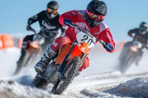 Riders compete in a thrilling motocross race on a snowy track in winter during bright sunny weather photo