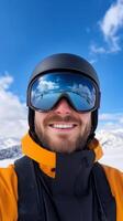 A smiling skier takes a selfie on a sunny day in the snowy mountains, showcasing clear blue skies and breathtaking scenery photo