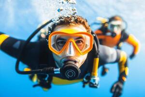 Diving enthusiasts explore vibrant underwater life in clear blue waters during a sunny afternoon photo