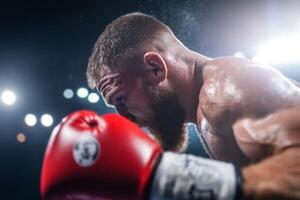 Boxer prepares for a powerful strike during an intense match in the ring, showcasing determination and focus under bright lights photo