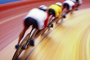 Cyclists speed around an indoor velodrome in a competitive race photo