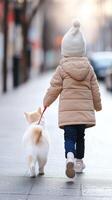 A child walks a fluffy white dog along a quiet street during a chilly morning in winter, showcasing a cozy neighborhood atmosphere photo