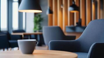 Cozy modern interior of a cafe with a stylish armchair and coffee cup at a well-lit table during the afternoon photo