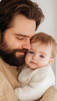 A father lovingly embraces his baby in a cozy indoor setting, showcasing the bond between them during a quiet moment photo