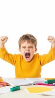 Young boy in a yellow sweater expressing frustration while studying at a desk filled with school supplies during homework time photo