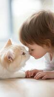 A child gently touches noses with a fluffy cat indoors, showcasing an adorable moment of friendship and affection between them photo