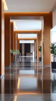 Modern hallway inside a sleek office building showcasing polished floors and vibrant greenery in the early afternoon light photo