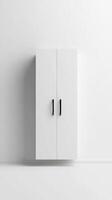 Modern minimalist white cabinet with black handles against a plain wall in a contemporary interior setting photo