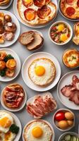 An abundant breakfast spread featuring eggs, meats, and breads arranged on a table ready for a delightful morning meal photo