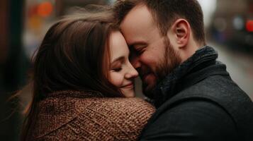 Couple sharing a warm embrace in a cozy urban setting during twilight in the heart of the city photo