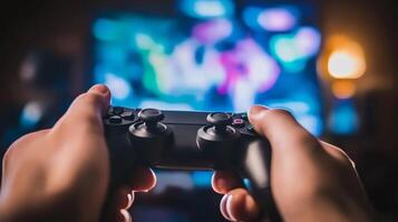 Person holding a game controller while playing on a television in a cozy indoor setting during the evening hours photo