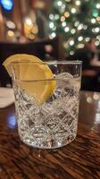Elegant Christmas Gin and Tonic with Lemon Slice photo