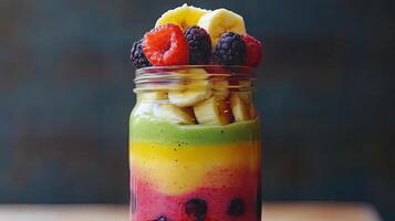 Layered Rainbow Smoothie in a Jar - A Healthy and Colorful Treat photo