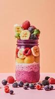 Layered Smoothie with Colorful Berries and Bananas photo