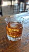 Amber Whiskey Cocktail with Ice Cubes - A Luxurious Drink photo
