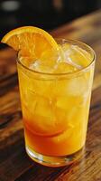 Refreshing Orange Drink with Ice and Aromatic Fresh Herbs photo