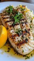 Fish Grilled to Perfection with Lemon and Rice A Flavorful Delight photo