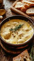 A Hearty Cheese Dip with a Smooth Creamy Texture Paired with Crusty Bread photo