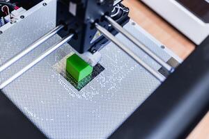 head of 3d printer in action photo