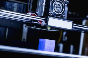 head of 3d printer in action photo