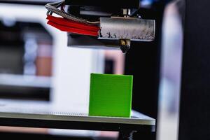 head of 3d printer in action photo