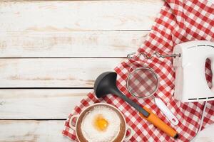 baking preparation, top view of a variety of baking utensils and ingredients photo