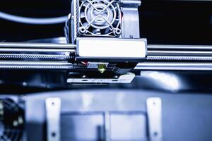 head of 3d printer in action photo