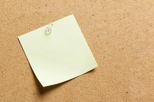 Color sticker notes over cork board background photo