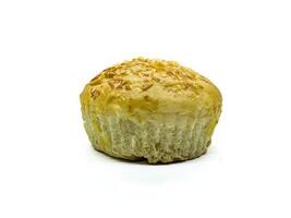A close up of a freshly baked bread roll topped with shredded cheese, showcasing its golden brown crust and soft, fluffy texture. Perfect for bakery or food related content photo