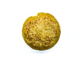 A close up of a golden brown bread roll topped with shredded cheese, isolated on a white background. Perfect for bakery, food, and culinary themes photo