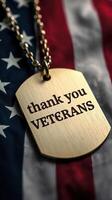 Brass dog tag with embedded message honoring veterans draped over a vintage American flag photo