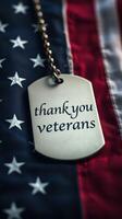 Honoring veterans with a metal dog tag resting on an American flag backdrop photo