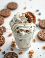 Delicious dessert featuring creamy ice cream topped with cookies and nuts served in a glass photo