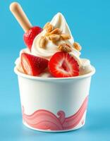 Delicious soft-serve ice cream topped with fresh strawberries and crunchy peanuts in a vibrant blue background photo